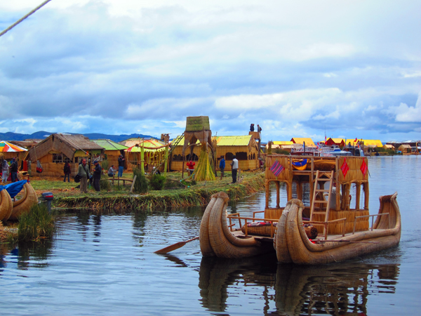 The islands and typical boats used by the Uros Tribe around the floating islands of Lake Titicaca